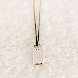 Minimalist polished silver bar necklace with sleek design, a top gift idea for men.