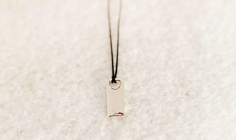 Minimalist polished silver bar necklace with sleek design, a top gift idea for men.