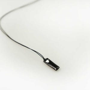 Custom bar necklace in black plated silver, perfect for birthdays or special occasions.