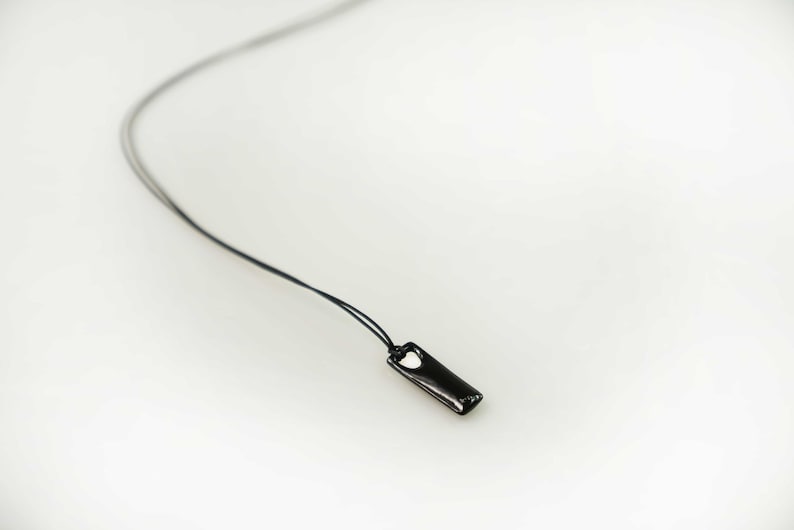 Custom bar necklace in black plated silver, perfect for birthdays or special occasions.