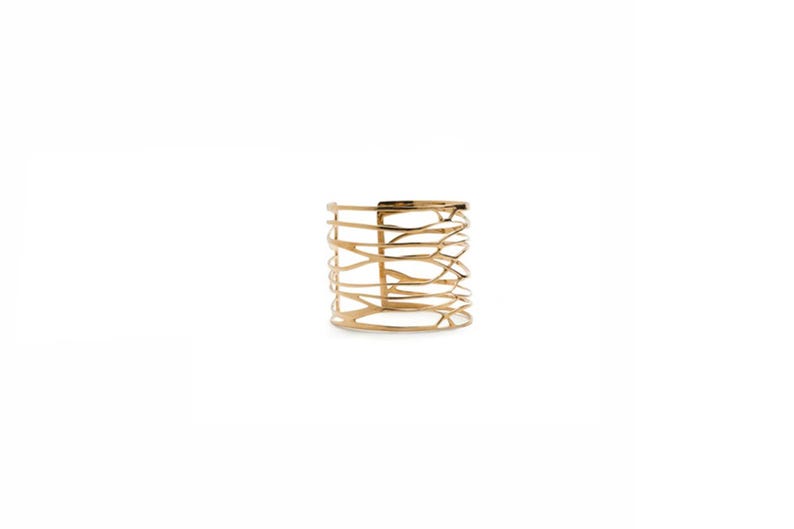Nature-inspired cuff bracelet in polished brass, a distinctive piece for women who appreciate refined, statement jewelry.