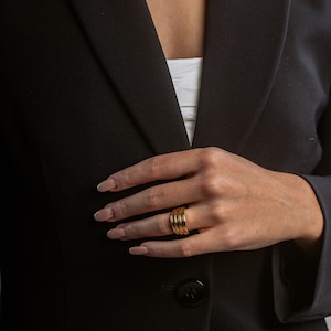 Gold plated 'Pinnacle' brutalist silver woman ring, showcasing abstract design.