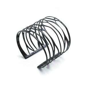 Wide Cuff Bracelet in black-plated silver with intricate branch patterns—an artistic piece for women seeking bold accessories.