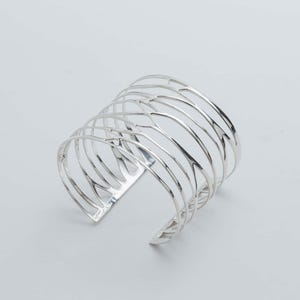Handcrafted Silver Cuff Bracelet in pure silver, offering a perfect blend of elegance and bold design for modern women.