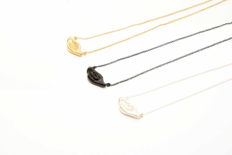 Aura necklace a handcrafted organic masterpiece in polished silver, gold, and black plated. Unique, contemporary, and perfect for every day.