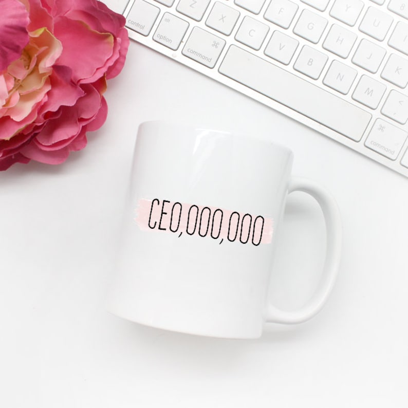 Girl Boss Mug with the text in black CEO,000,000 with a pink stripe across it
