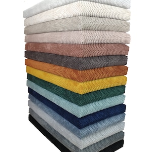 May include: A stack of 14 fabric swatches in various colors, including white, gray, beige, pink, brown, orange, yellow, green, blue, and black. The fabric has a textured, woven appearance.