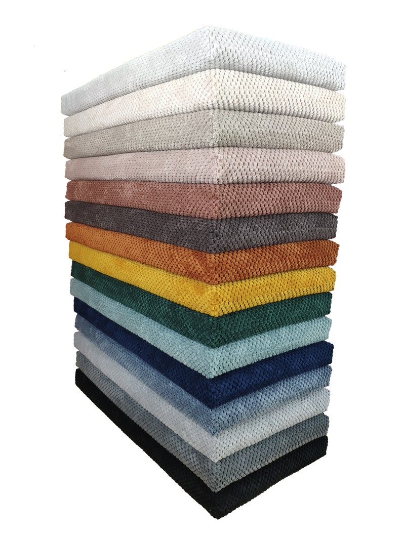 May include: A stack of 14 fabric swatches in various colors, including white, gray, beige, pink, brown, orange, yellow, green, blue, and black. The fabric has a textured, woven appearance.