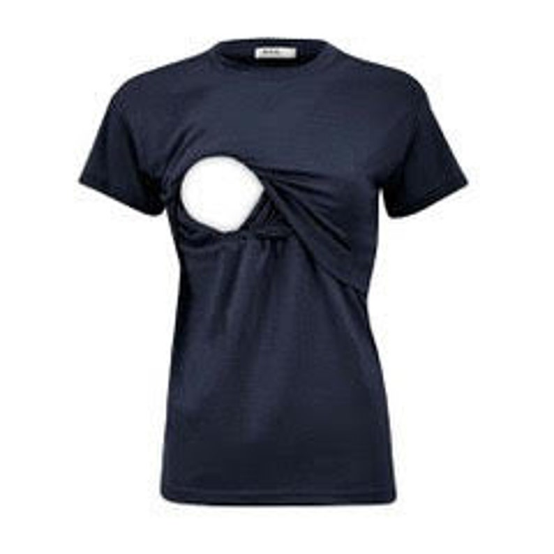 May include: A dark navy blue short-sleeved t-shirt featuring a layered design on the front chest area. The top layer of fabric is lifted to reveal a circular white opening underneath, creating a functional overlapping style with a crew neckline.