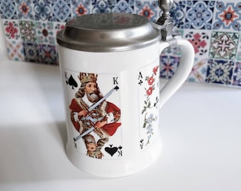 Vintage German ceramic beer stein with playing cards motifs