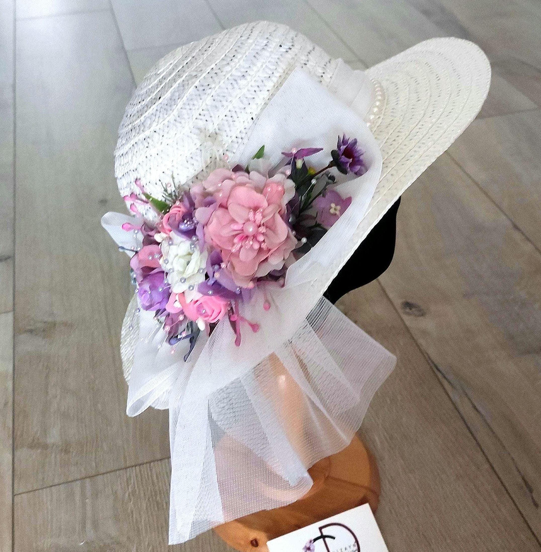 White Summer Straw Hat with a pink floral spray and a gossamer ribbon 12.5\