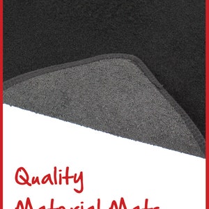 May include: Close-up of a black car floor mat with a grey backing. The mat is made of high-quality material and is designed to protect your car's interior.