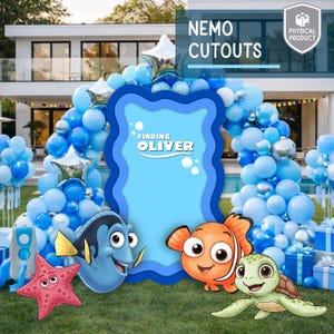 May include: A party decoration set featuring a blue arch of balloons, a large blue cutout with the text "Finding Oliver", and character cutouts from the movie "Finding Nemo". The set includes a starfish, Dory, Nemo, and a turtle.