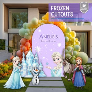 May include: A party backdrop display featuring a large purple arched sign with the text Amelie's Frozen Dreams, surrounded by a colorful balloon arch. Includes cutouts of a blue ice castle, a snowman, a blonde character, a reindeer, and a girl.