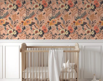 May include: A nursery room with a crib and a peach-colored floral wallpaper. The wallpaper features a repeating pattern of flowers, leaves, and branches in shades of orange, yellow, green, and brown.