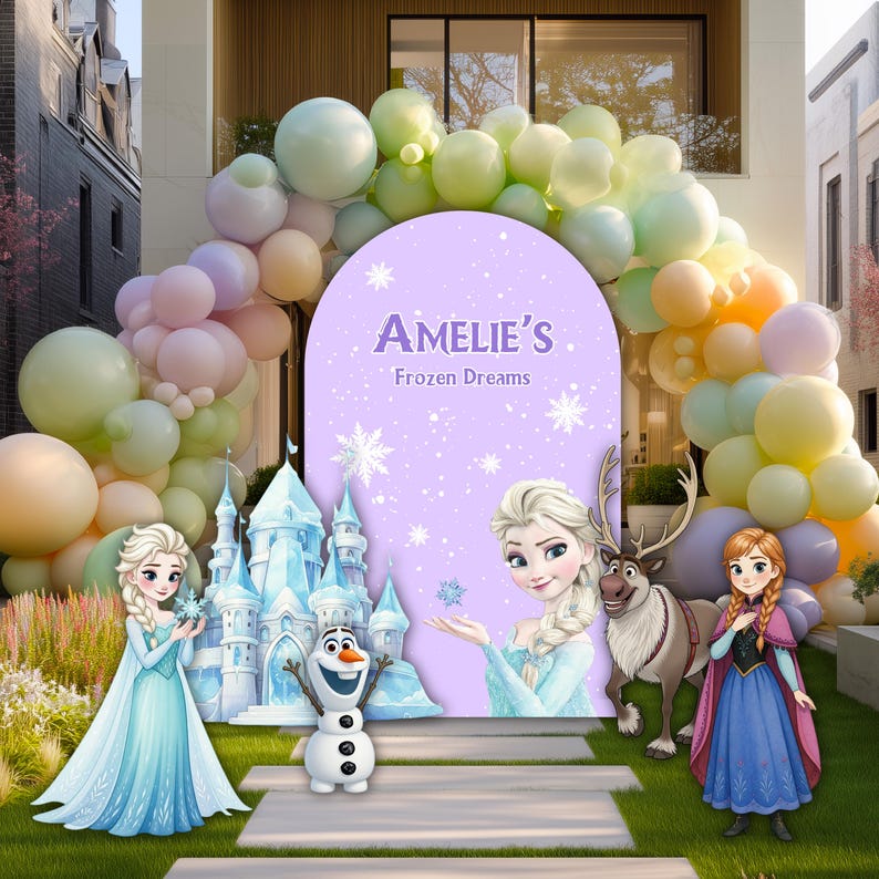 May include: A purple arched backdrop featuring the text Amelie's Frozen Dreams, surrounded by a large balloon arch in pastel colors. The display includes cutouts of two blonde characters, a snowman, a reindeer, and an ice castle.
