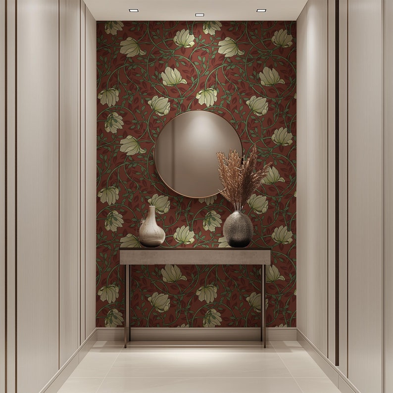 May include: A hallway with a brown floral wallpaper, a round mirror, a table with two vases, and a white tiled floor.