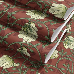 May include: A repeating pattern of white flowers and green leaves on a deep red background. The fabric is folded to show the pattern repeating.