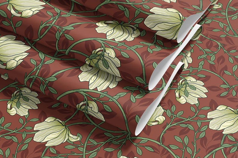 May include: A repeating pattern of white flowers and green leaves on a deep red background. The fabric is folded to show the pattern repeating.
