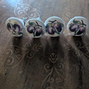 Vintage porcelain cabinet drawer knobs with painted plum fruit motif set of 4