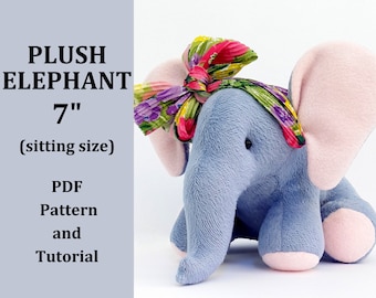 May include: A plush gray elephant toy with pink ears and feet, wearing a floral headband. The elephant is sitting and measures 7 inches tall. The image includes the text "PLUSH ELEPHANT 7" (sitting size) PDF Pattern and Tutorial".