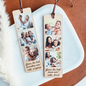 May include: Two wooden photo bookmarks with a vertical strip of four photos each. The top bookmark has photos of a grandmother and granddaughter. The bottom bookmark has photos of a mother and daughter. The text on the bookmarks reads "You're the best Grandma ever! LOVE, ELOWYN" and "You're the best Mom ever! LOVE, MILA".