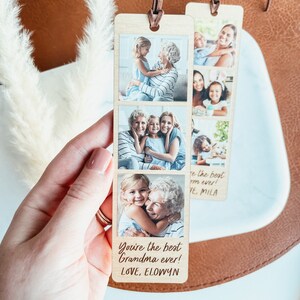 May include: Wooden bookmark with a photo collage of a grandmother and her grandchildren. The bookmark has the text "You're the best Grandma ever! LOVE, ELOWYN" on the bottom.