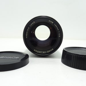 Yashica DSB f/2.8 135mm Lens with Both Caps In Good Condition.
