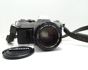 Canon AE-1 Program SLR Film Camera with FD 50mm f/1.4 S.S.C lens.