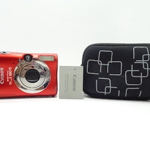 Canon Digital IXUS 980 14.7MP Digital Camera - Red with Battery , Charger & Case.