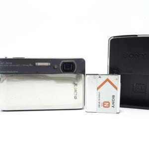 Sony Cyber-Shot DSC-TX5 10.2MP Waterproof Digital Camera - Silver with Battery & Charger.