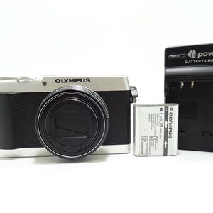 Olympus STYLUS SH-1 16.0MP Digital Camera -  Silver With Battery & Charger.