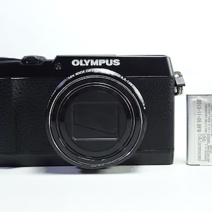 Olympus STYLUS SH-1 16.0MP Digital Camera BLACK With Battery In Good Condition.