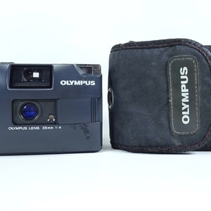 Olympus Trip MD 35mm Film Camera Point & Shoot Black With Case In Good Condition.