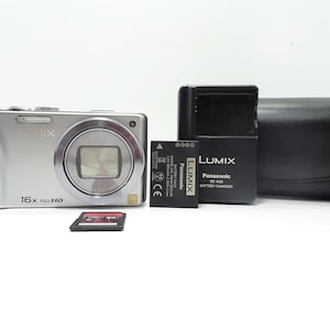 Panasonic Lumix DMC-TZ20 14.1MP Digital Compact Camera with Accessories.