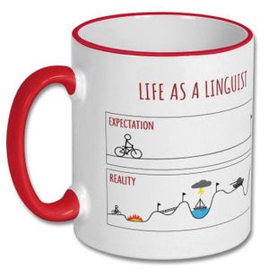 May include: White ceramic mug with a red handle and rim. The mug features the text "LIFE AS A LINGUIST" and a humorous illustration comparing expectations to reality, including a cyclist and a boat.