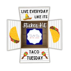 May include: A sticker kit in a cardboard box with a gray and white striped pattern. The box is open and the inside shows a sticker of a taco, a maraca, and a sombrero. The text on the box says "Live Everyday Like It's Taco Tuesday" and "Sticker Kit".