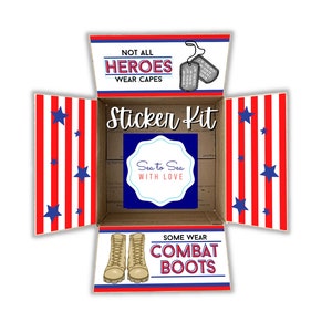 May include: An open box with red and white stripes and blue stars. The box contains a sticker kit with the text "Sticker Kit" and "Sea to Sea with Love". The box also has the text "Not all heroes wear capes" and "Some wear combat boots".
