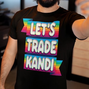 May include: A black t-shirt with a rainbow design and the text "Let's Trade Kandi" in white letters.