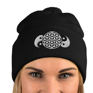 May include: Black beanie with a white embroidered design featuring a flower of life symbol and two yin yang symbols.