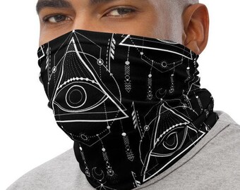 May include: A black face mask with a white geometric pattern featuring an eye design. The pattern is repeated throughout the mask.