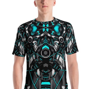 May include: A black t-shirt with a blue and gray geometric pattern. The pattern resembles a robot or machine with a circular eye in the center.