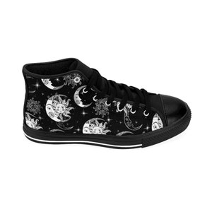 May include: Black high-top canvas sneakers with a white sun and moon pattern.