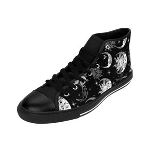 May include: Black high-top canvas shoes with a white sun and moon pattern. The pattern is repeated throughout the shoe.