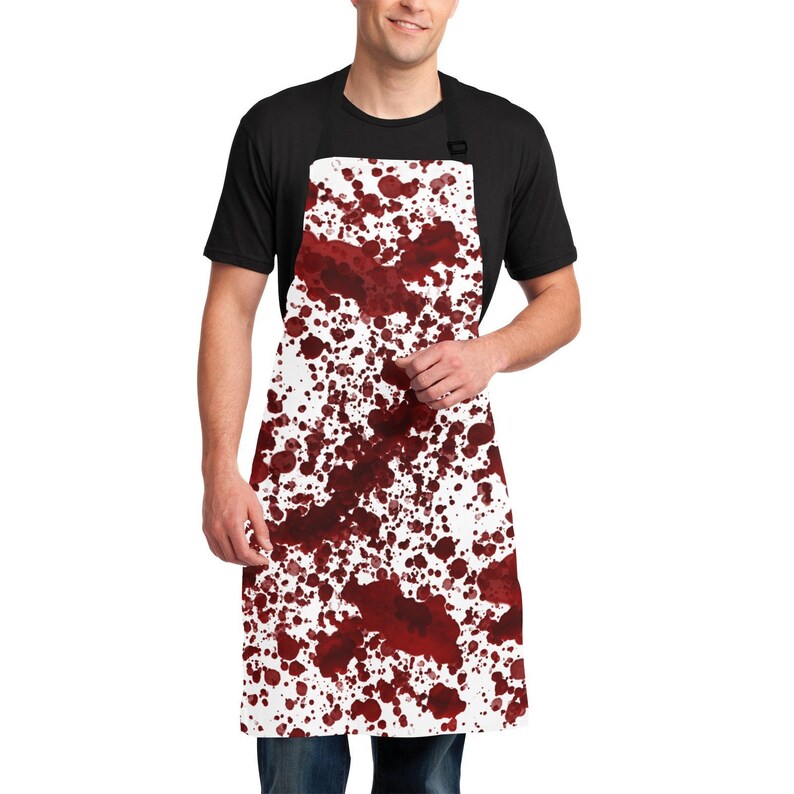 May include: A white apron with a red blood splatter pattern. The apron is worn by a person, but the person is not visible in the image.