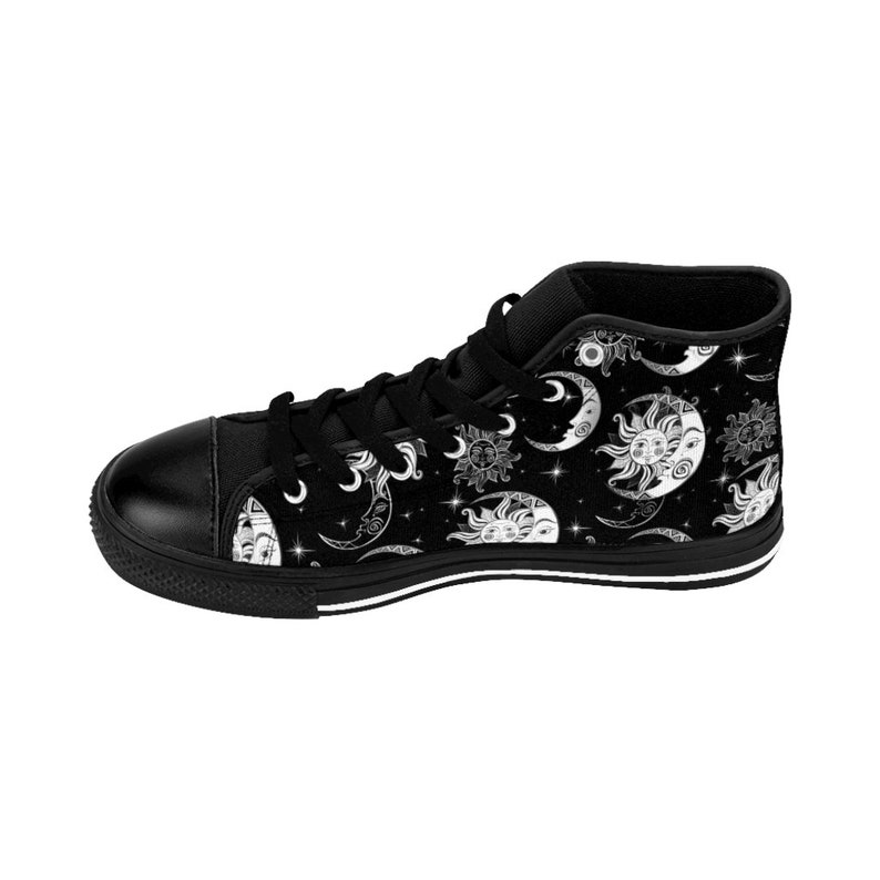 May include: Black high-top canvas shoes with a white sun and moon pattern. The pattern features celestial bodies with faces and stars.
