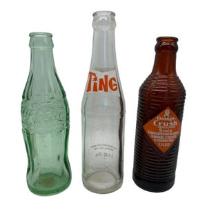 Lot of 3 Vintage Glass Soda Pop Bottles  Coca Cola  Ting  Orange Crush