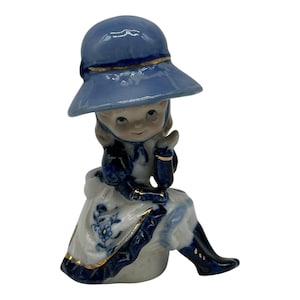 Vintage Small Sitting Girl in Blue & White Figurine W/ Hat Gold Accents  4” Tall