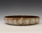 A 10.5 quot wide one of a kind handmade wheel thrown shallow serving ceramic bowl. Can be used also as a suiban an Ikebana container vase.