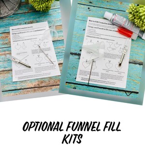 May include: Two instruction sheets with illustrations on how to fill cremation jewelry. The sheets are on a blue and white wooden surface. The sheets include a list of things you'll need to fill your cremation jewelry, such as small funnel, adhesive glue, and a toothpick. The sheets also show how to fill the jewelry with a threaded bale or screw.